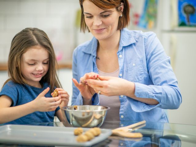 Mother-and-daughter-cooking-with-cookie-dough